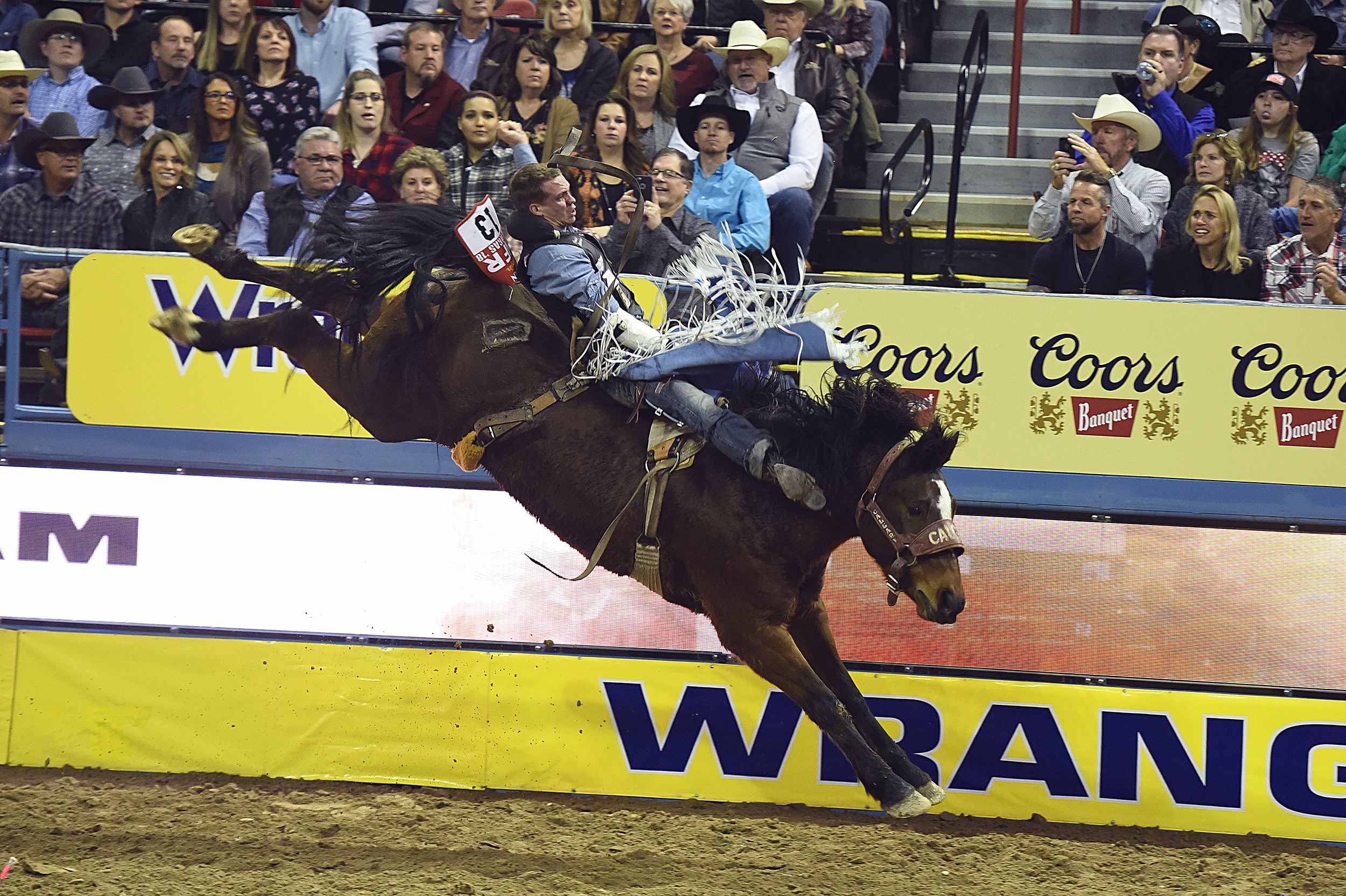 Orin Larsen matches moves with Calgary Stampede's Trail Dust for 87 points to finish second in the third round of the National Finals Rodeo. (PHOTO BY ROBBY FREEMAN)
