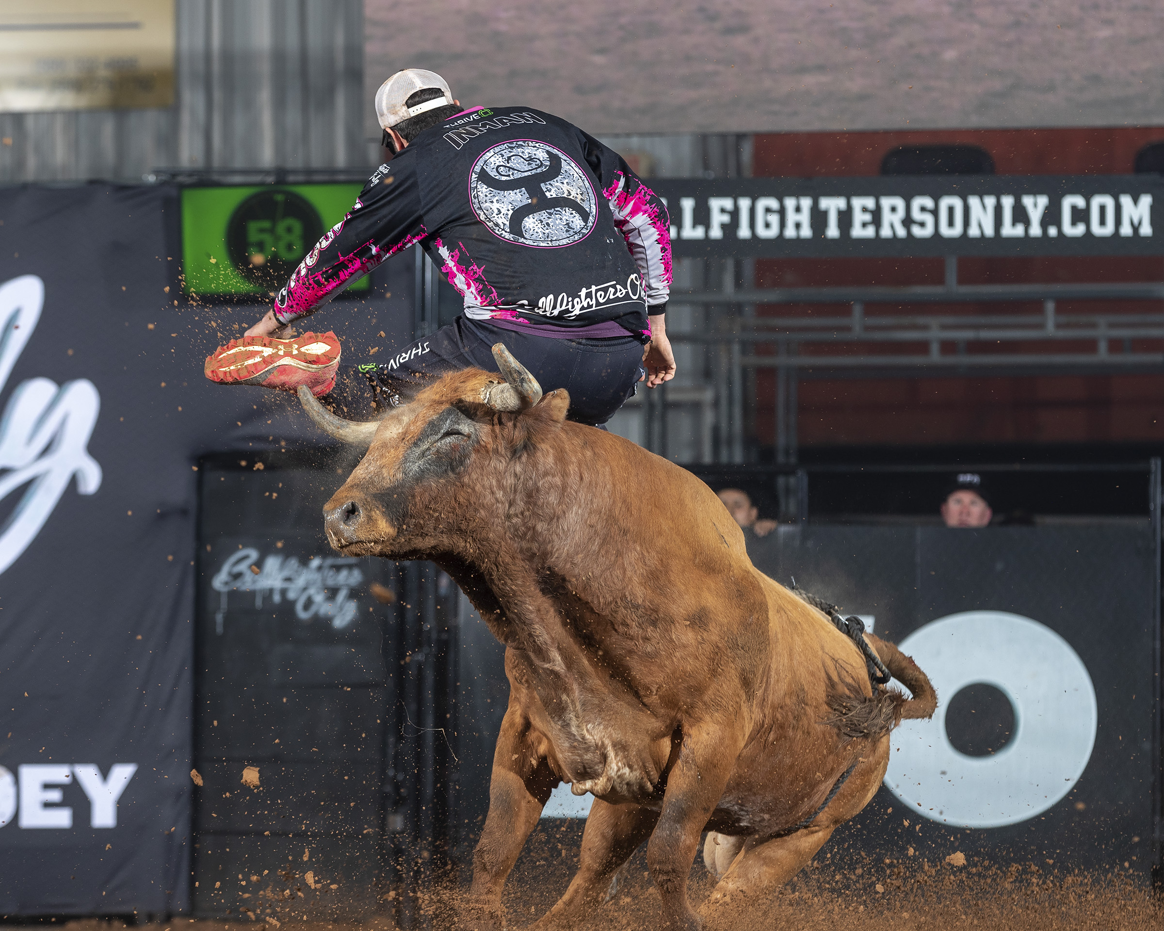 Toby Inman leaps over his bull during his Hooey Championship Round bout, where the Illinois man scored 87 points to win the Bullfighters Only Ada Invitational. (PHOTO BY TODD BREWER)