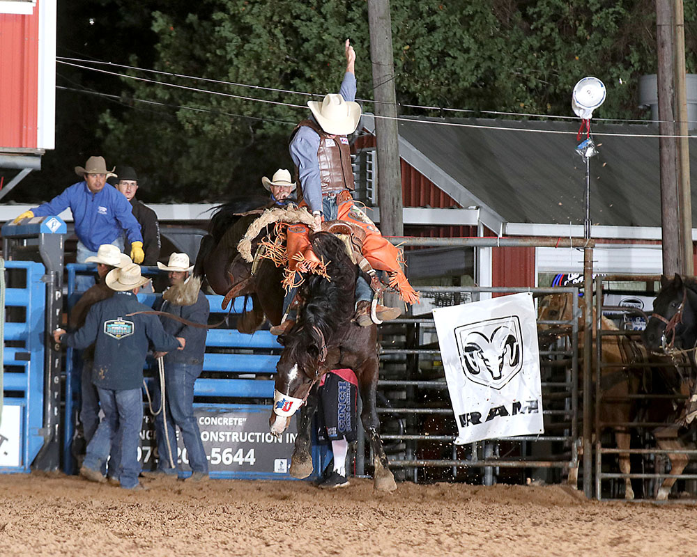 Parker Kempfer rides Rocky Mountain Rodeo's Cimarron for 81.5 points Friday night to tie for the saddle bronc riding lead at the Austin County Fair's Rodeo. (PHOTO BY PEGGY GANDER)