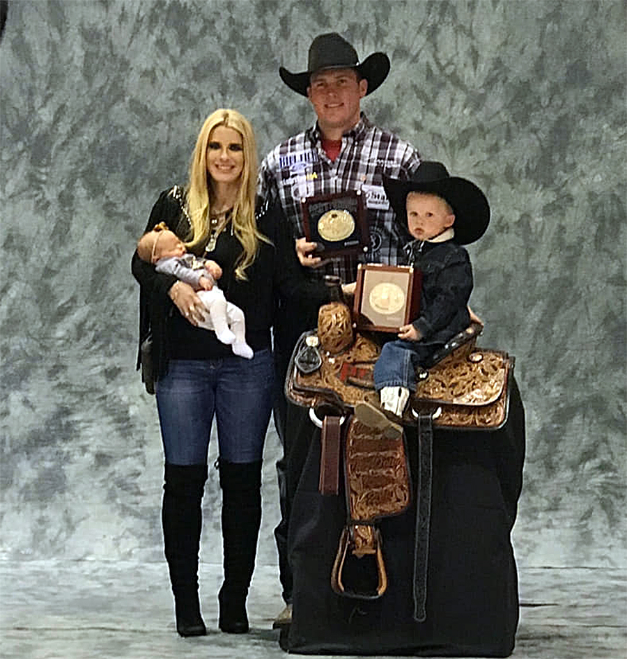 Two-time world champion Caleb Smidt of Bellville is shown displaying his gold buckle and other wares after the 10th round of the 2018 National Finals Rodeo. He will compete at the Austin County Fair's rodeo this week.