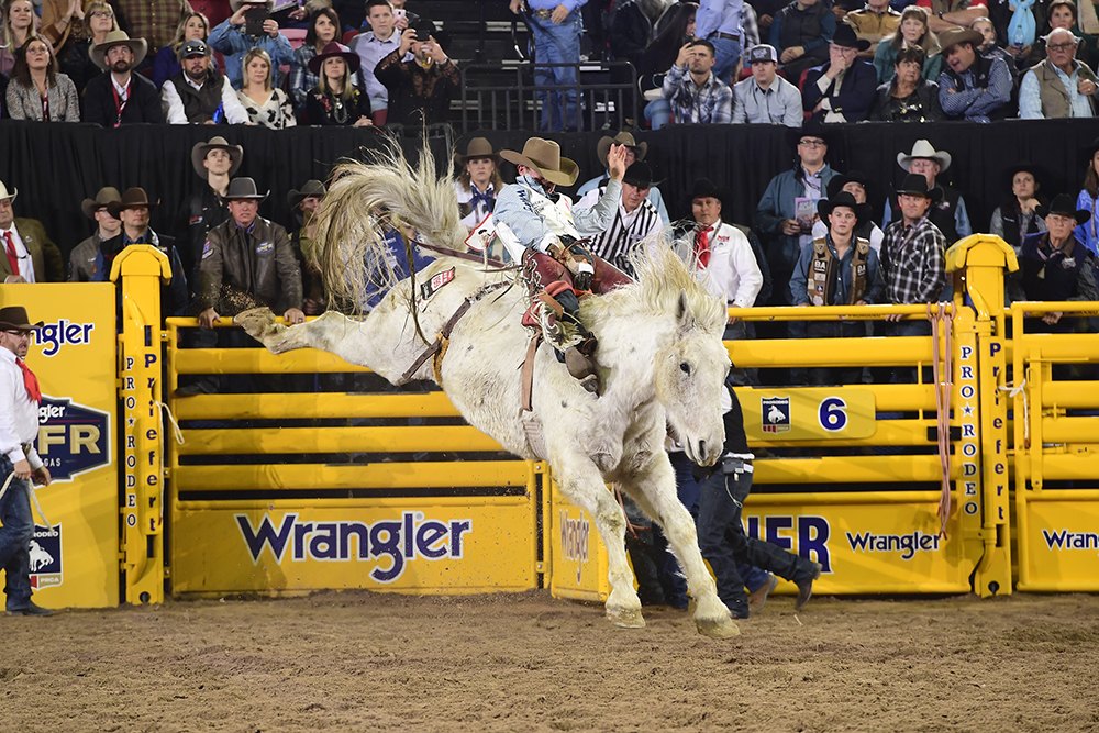 Clayton Biglow took advantage of his reride on Wayne Vold Rodeo's Mucho Dinero to finish in a tie for third place in Friday's ninth round of the National Finals Rodeo. (PRCA PRORODEO PHOTO BY JAMES PHIFER)
