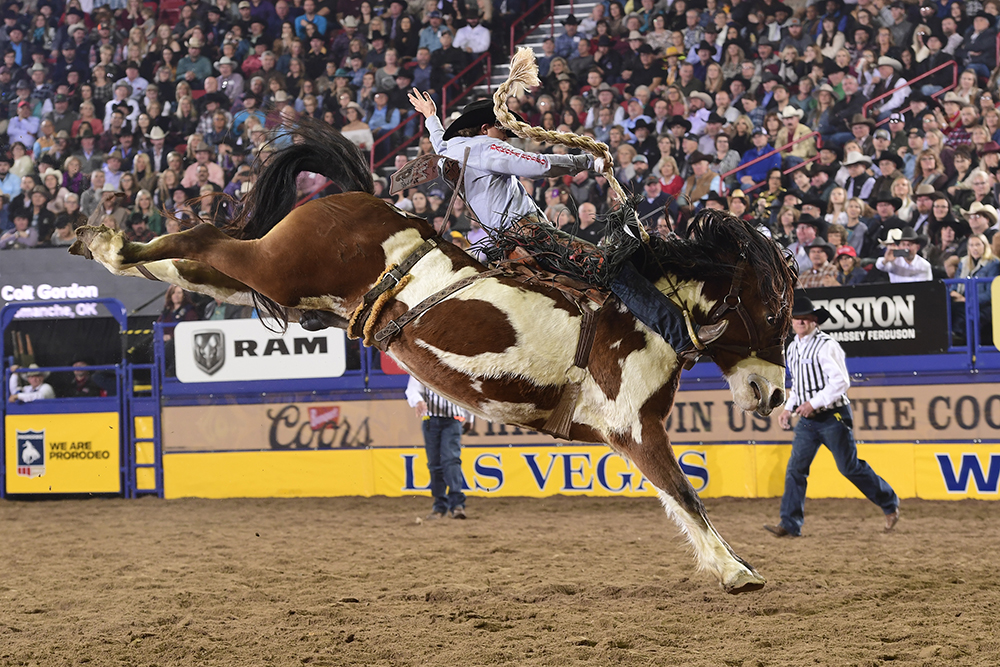 Colt Gordon rides Stace Smith's Top Hat for 87.5 points Saturday night to place for the third time at his first National Finals Rodeo. (PRCA PRORODEO PHOTO BY JAMES PHIFER)