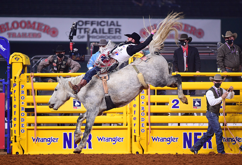 Mason Clements rides Sankey Rodeo's Mental Illness to place in Thursday's eighth round of the National Finals Rodeo. (PHOTO BY JAMES PHIFER)