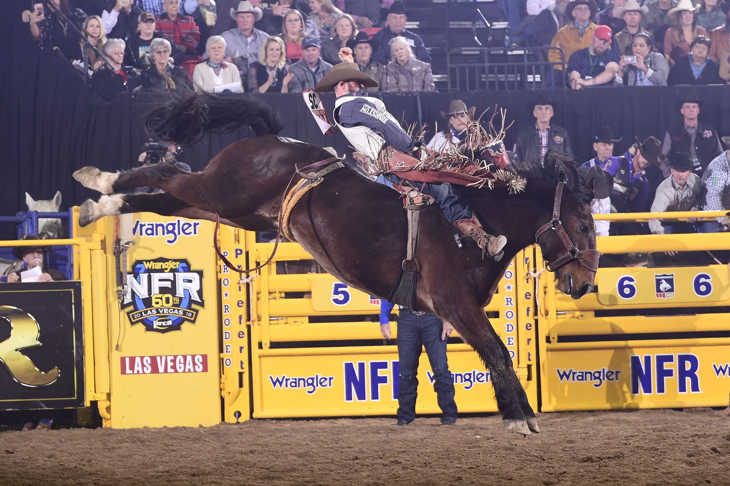 Mason Clements spurs Frontier Rodeo's Full Baggage for 88.5 points Thursday night to finish as runner-up in the eighth round of the National Finals Rodeo. (PRCA PRORODEO PHOTO BY JAMES PHIFER)