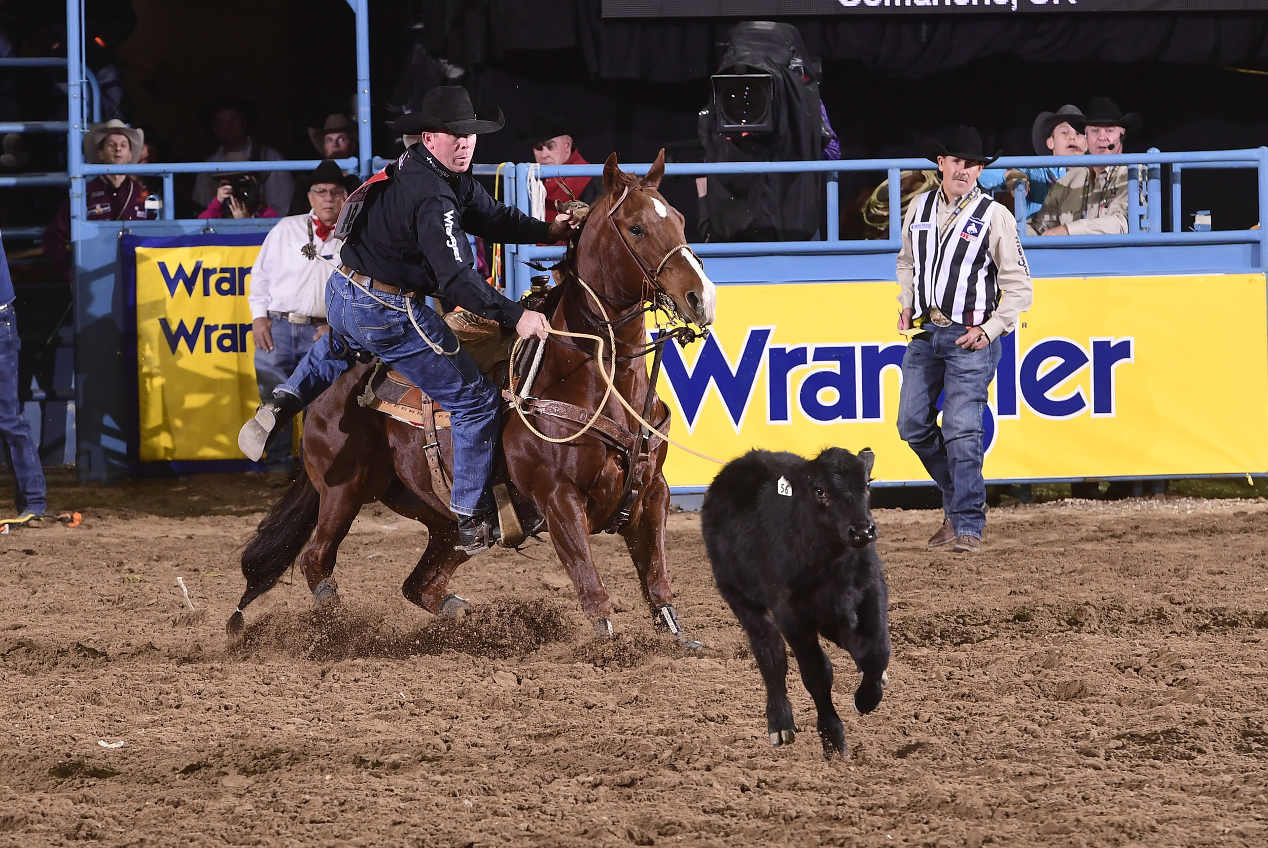 Tie-down roper Ryan Jarrett ropes his calf en route to a 7.8-second run Wednesday to finish fourth in the seventh round of the National Finals Rodeo. (PRCA PRORODEO PHOTO BY JAMES PHIFER)