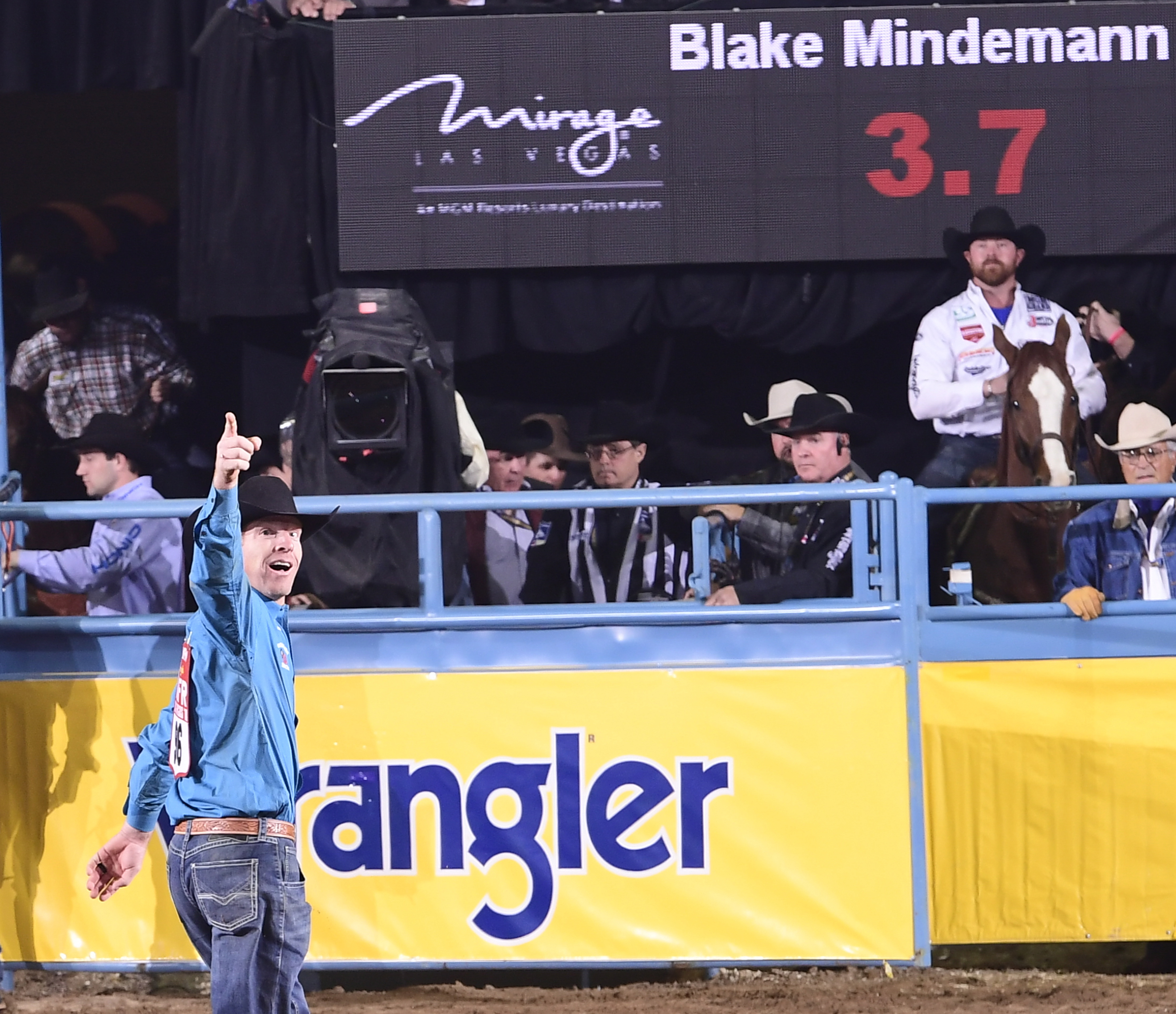 Steer wrestler Blake Mindemann celebrates his 3.7-second run Friday to finish as the runner-up in the ninth round of the National Finals Rodeo. (PRCA PRORODEO PHOTO BY JAMES PHIFER)