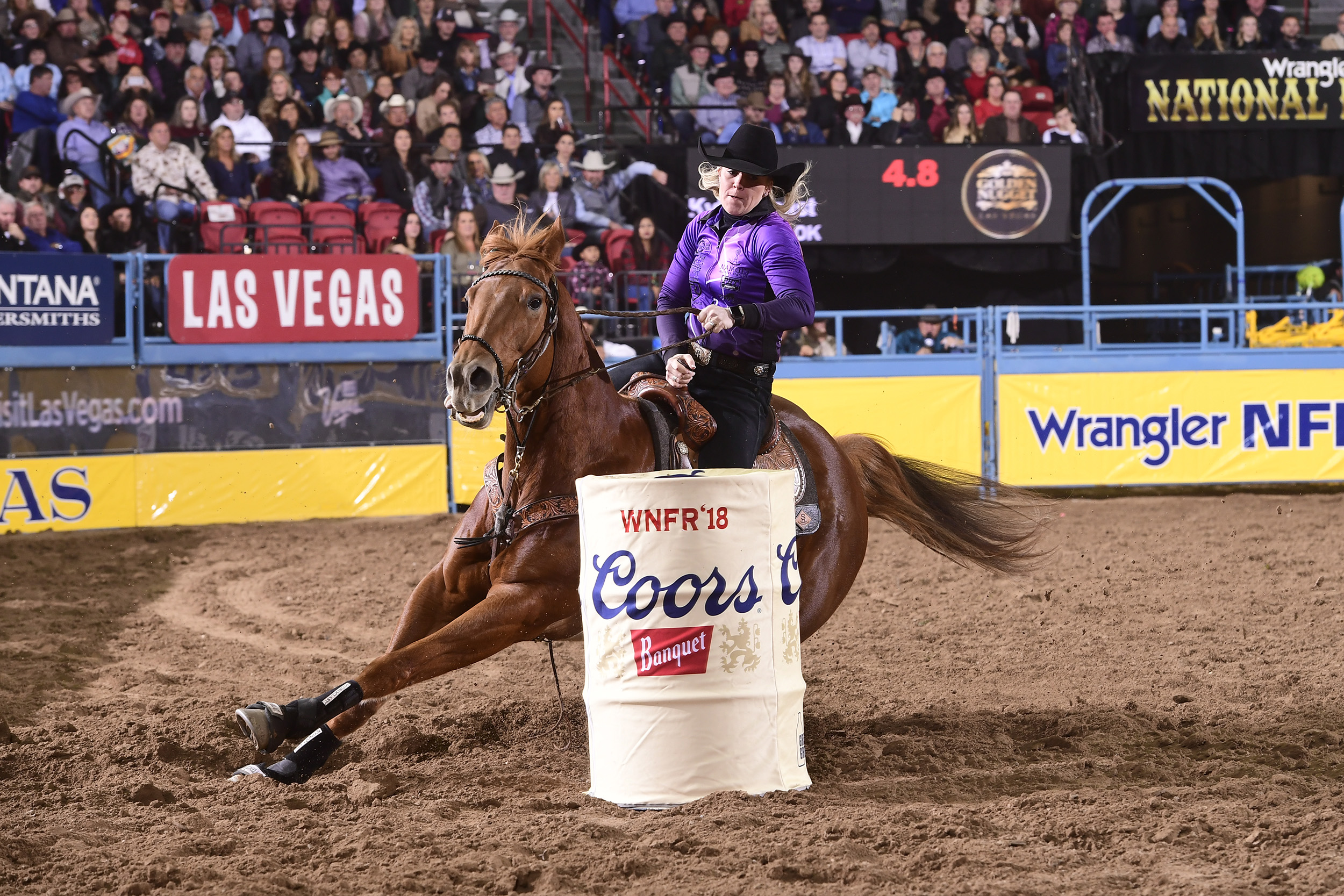 Kylie Weast and Reddy turn the second barrel en route to a 13.74-second run Wednesday to finish in a tie for fourth place in the seventh round of the National Finals Rodeo. (PRCA PRORODEO PHOTO BY JAMES PHIFER)