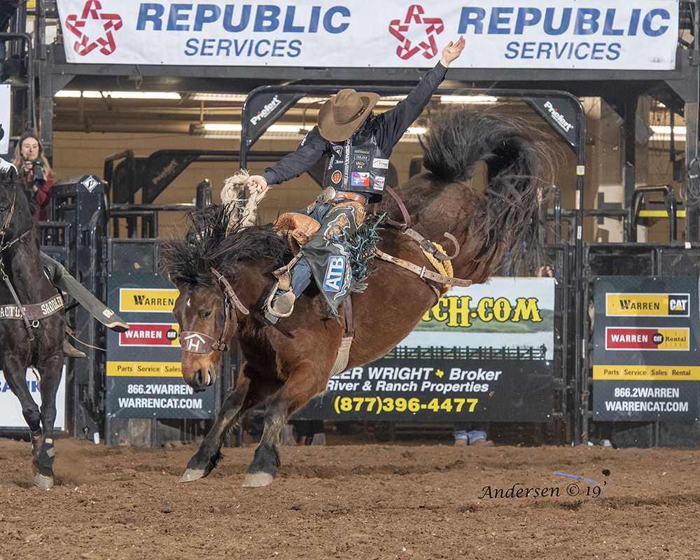 Zeke Thurston rides Rafter H Rodeo's Aces Wild for 88.5 points Wednesday night to take the saddle bronc riding lead at the San Angelo Stock Show and Rodeo. (PHOTO BY RIC ANDERSEN)