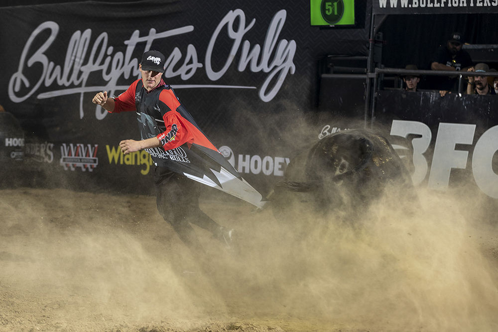 Aaron Mercer slips out of the way of a bull earlier this month in Kennewick, Washington, as the bull grabs ahold of Mercer's jersey with its horn. Mercer has been on a fast rise to the top of Bullfighters Only. (PHOTO BY TODD BREWER)
