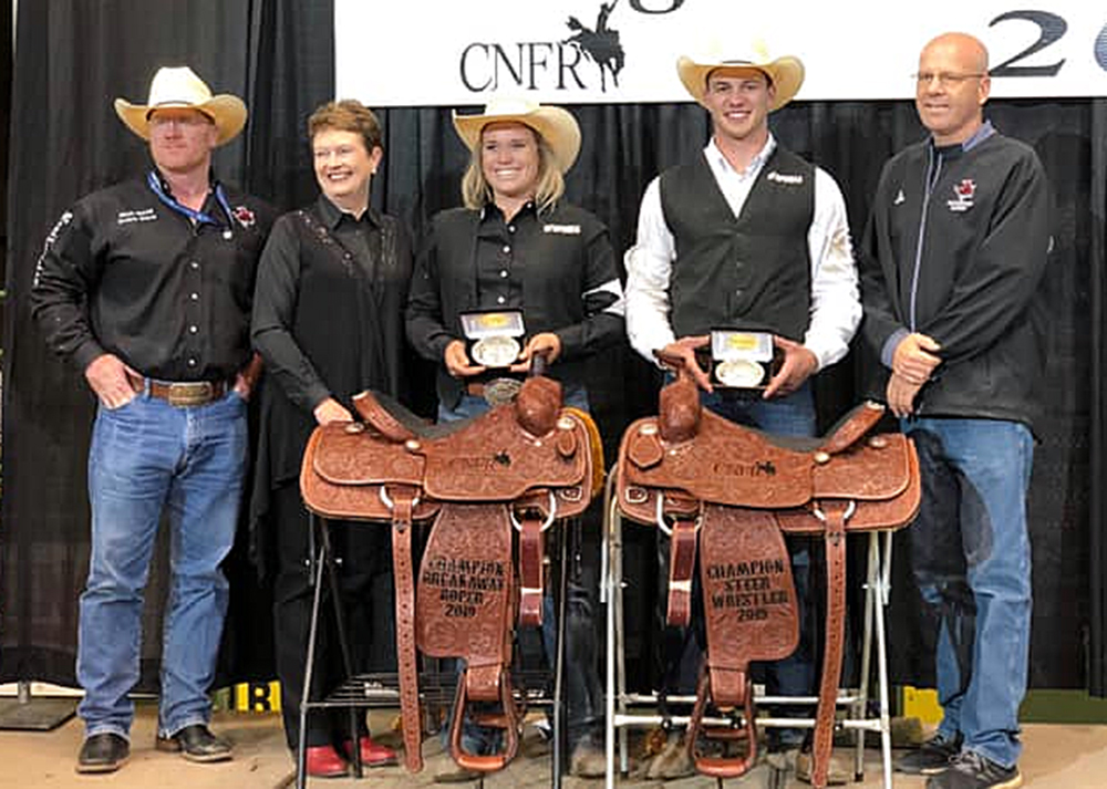 Northwestern Oklahoma State University breakaway roper Taylor Munsell and steer wrestler Bridger Anderson earned national championships this past week at the College National Finals Rodeo in Casper, Wyoming. Pictured are, from left, coach Stockton Graves, university president Janet Cunningham, Munsell, Anderson and athletic director Brad Franz. (PHOTO COURTESY OF NORTHWESTERN OKLAHOMA STATE UNIVERSITY RODEO)
