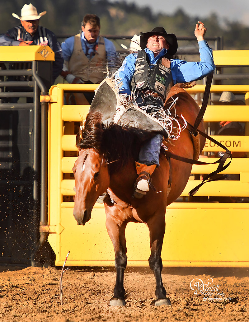 Steven Dent rides Cervi's Fire's Easy for 83 points to share the bareback riding lead at Rooftop Rodeo after Monday's first performance. (PHOTO BY GREG WESTFALL)