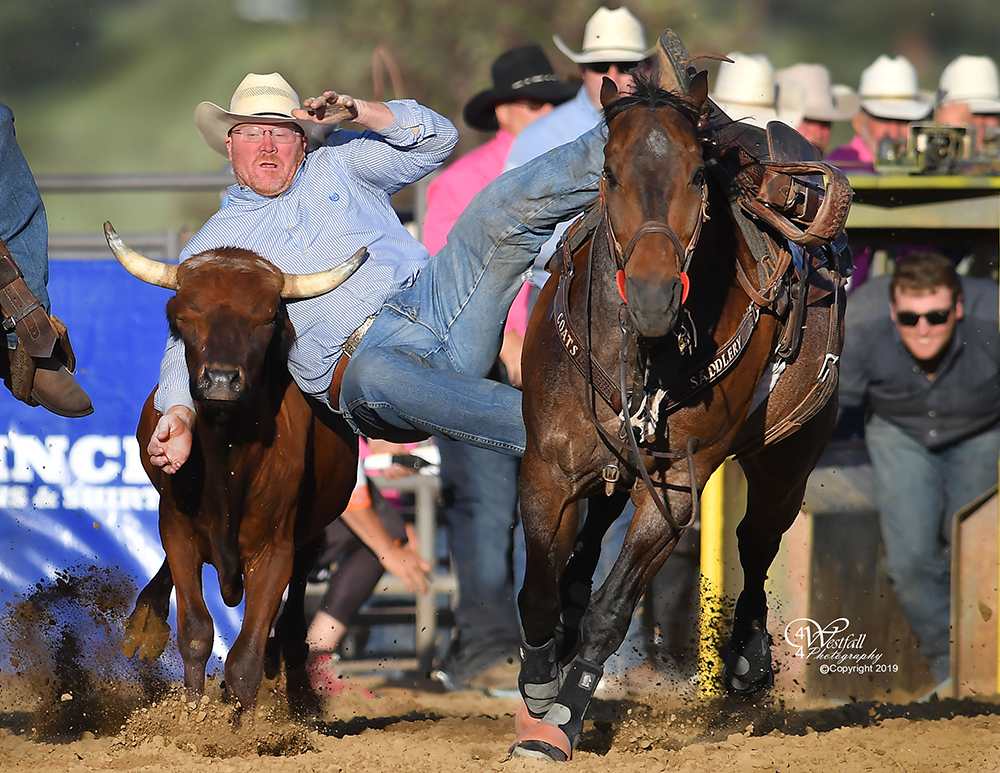 Stockton Graves, the rodeo coach at Northwestern Oklahoma State University, tutored his students well in taking the steer wrestling lead at Rooftop Rodeo. (PHOTO BY GREG WESTFALL)
