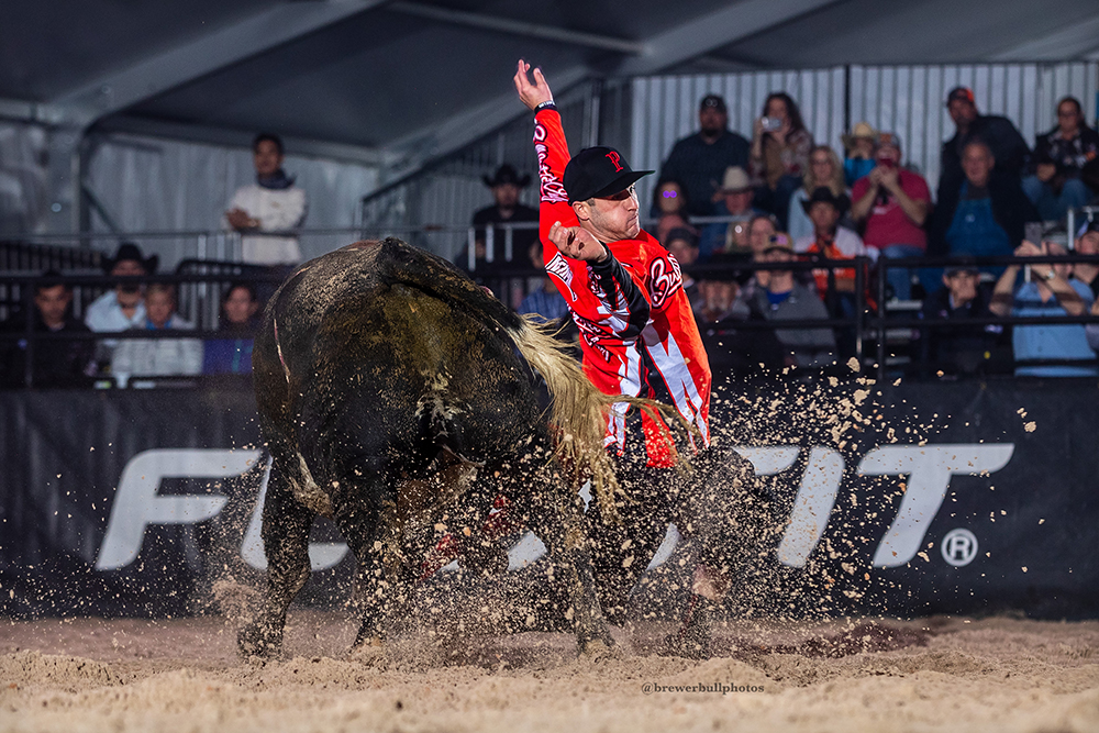 World champion Aaron Mercer of Calgary, Alberta, lets his bull slide by during his BFO Roughy Cup-winning bullfight on Thursday. (PHOTO BY TODD BREWER)