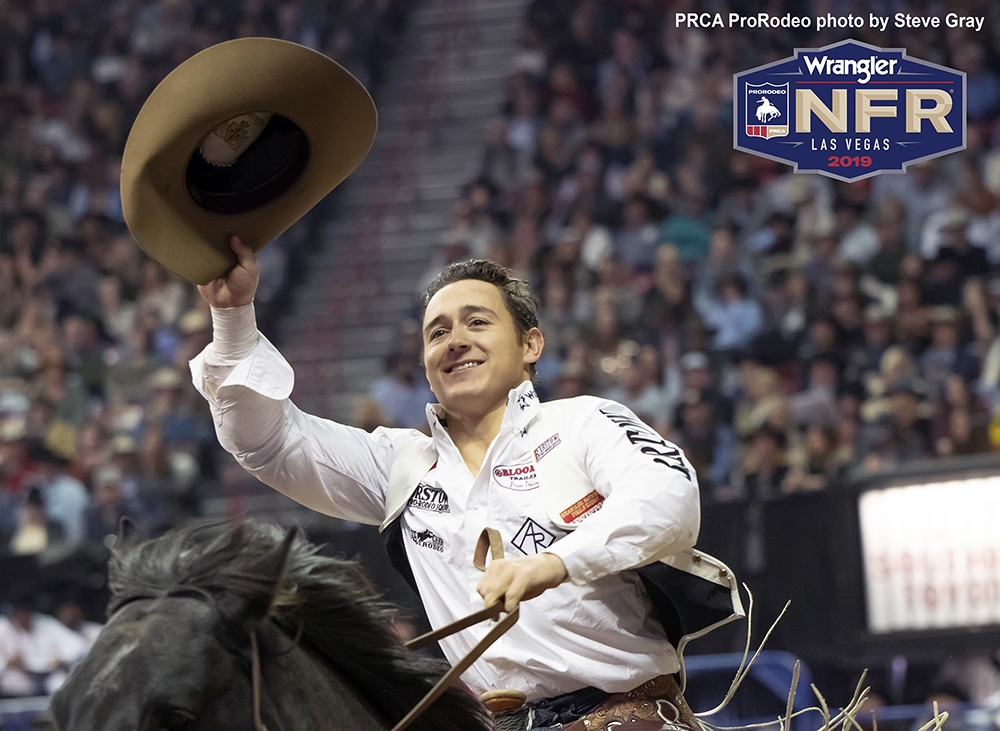 Tim O'Connell makes his victory lap after winning the 10th round, the National Finals Rodeo average title and the bareback riding world championship on Saturday night. (PRCA PRORODEO PHOTO BY STEVEN GRAY)
