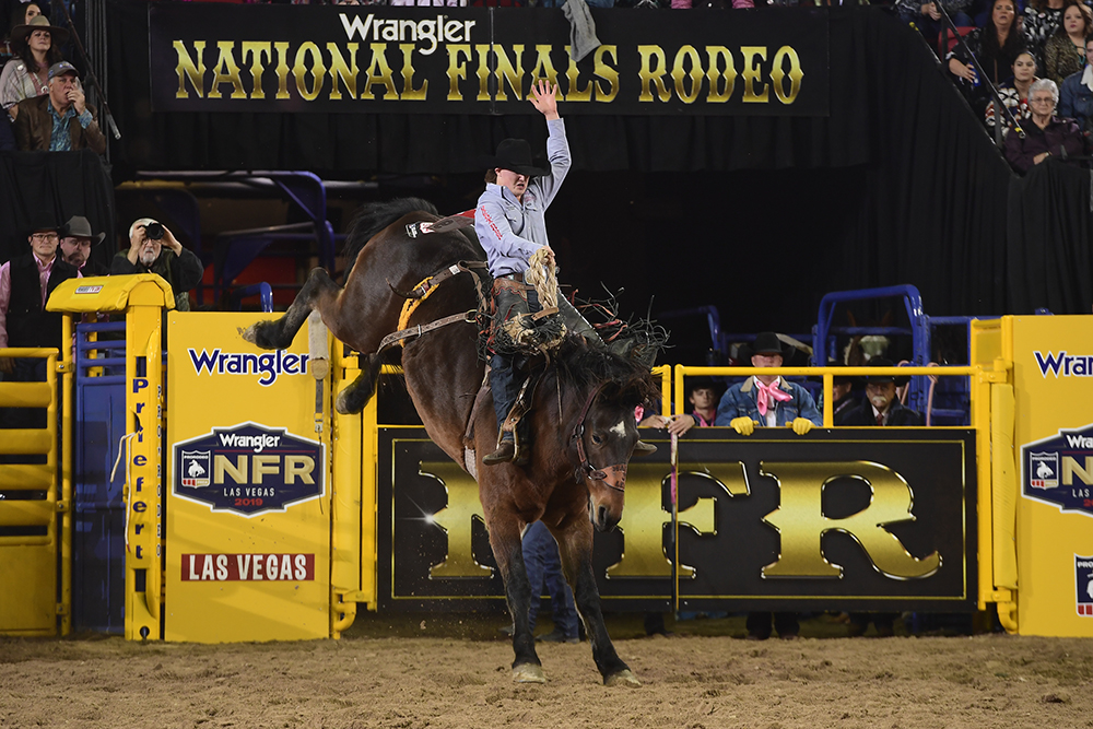 Colt Gordon rides Frontier Rodeo's Maple Leaf for 82 points to place in a tie for sixth place in Monday's fifth round of the National Finals Rodeo. (PRCA PRORODEO PHOTO BY JAMES PHIFER)