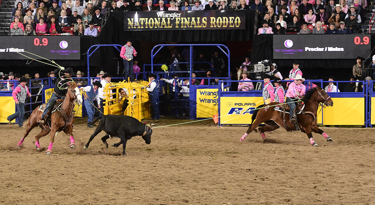 Ryan Motes, left, and Coleman Proctor finish off their 4.4-second run to finish in a tie for second place in Monday's second round of the National Finals Rodeo. (PRCA PRORODEO PHOTO BY JAMES PHIFER)