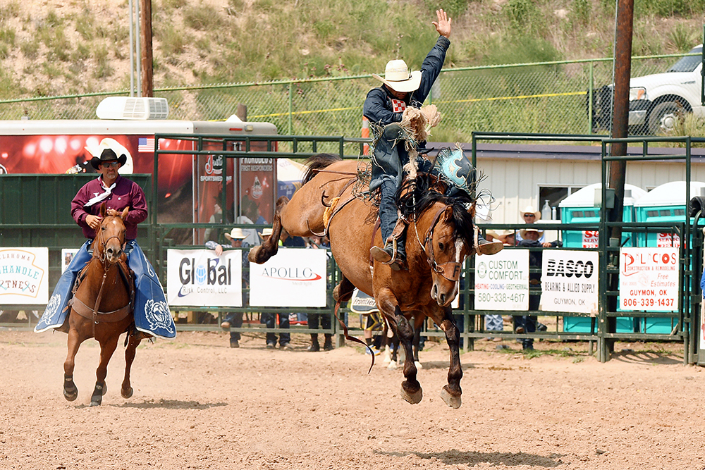 Isaac Diaz rides Frontier Rodeo's Yellowstone for 89 points Sunday afternoon to finish second in the saddle bronc riding at the Guymon Pioneer Days Rodeo. (PHOTO BY DALE HIRSHMAN)