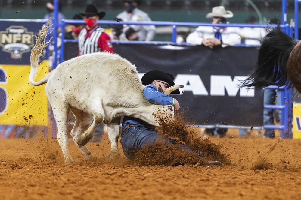 Bridger Anderson turns his steer during a 3.7-second run, which helped him place in Tuesday's sixth round of the National Finals Rodeo. (PHOTO BY JAMES PHIFER)