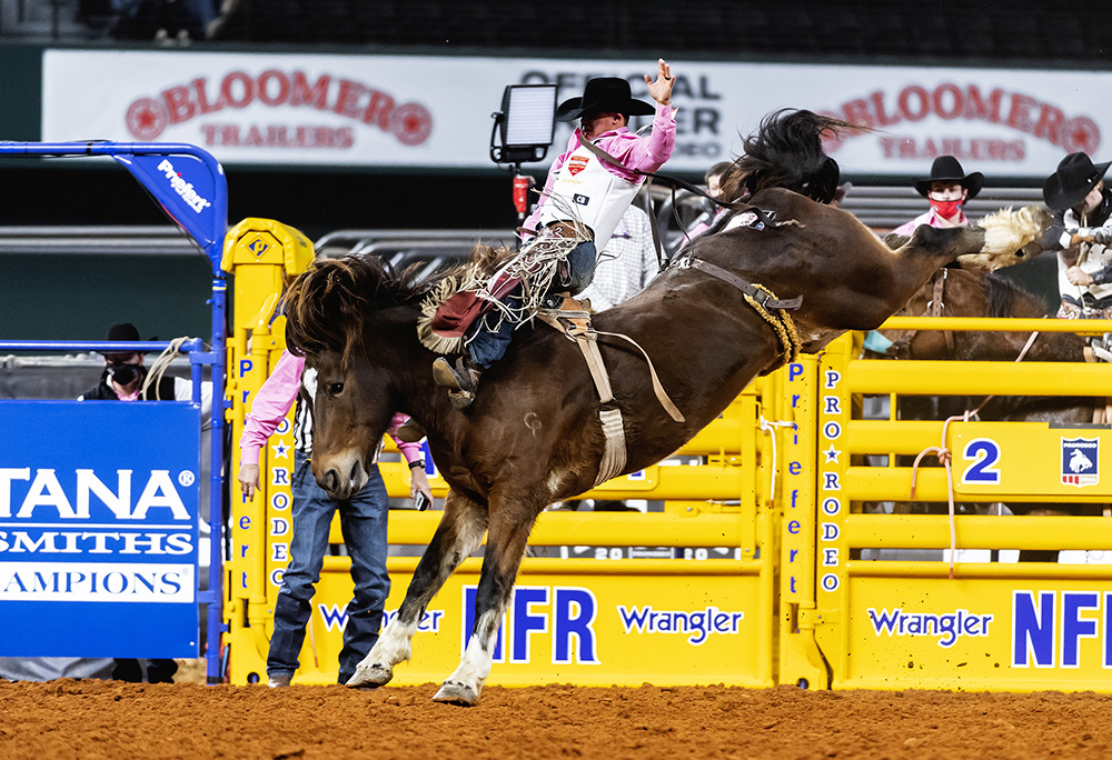 Clayton Biglow spurs Pickett Pro Rodeo's Top Flight for 89 points to win Monday's fifth round of the National Finals Rodeo. (PHOTO BY JAMES PHIFER)