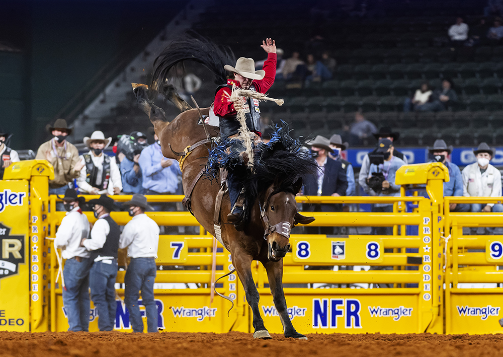 Wyatt Casper rides Powder River Rodeo's Miss Valley for 89 points to finish as the runner-up in Friday's second round of the National Finals Rodeo. (PHOTO BY JAMES PHIFER)