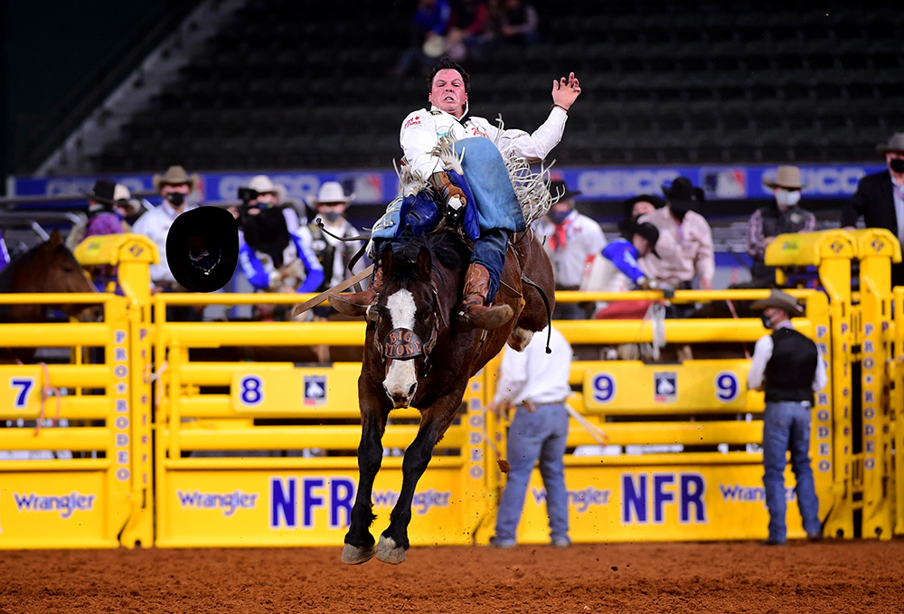 Richmond Champion rides Big Stone's Mayhem for 81.5 points to finish fifth in Wednesday's seventh round of the National Finals Rodeo. (PHOTO BY JAMES PHIFER)