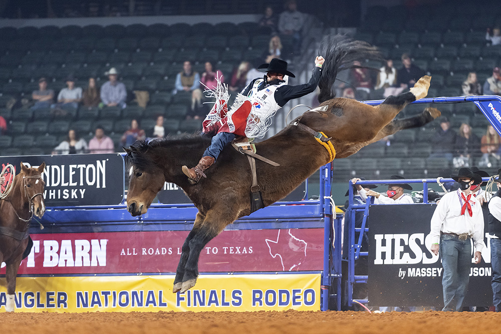 Mason Clements rides Frontier Rodeo's Show Stomper for 83 points to place in Saturday's third round of the National Finals Rodeo. (PHOTO BY JAMES PHIFER)