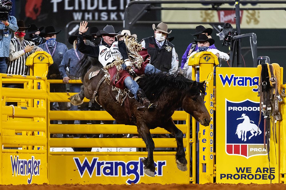 Tim O'Connell rides Fettig Pro Rodeo's Pop A Top for 90.5 points to win Sunday's fourth round of the National Finals Rodeo. (PHOTO BY JAMES PHIFER)