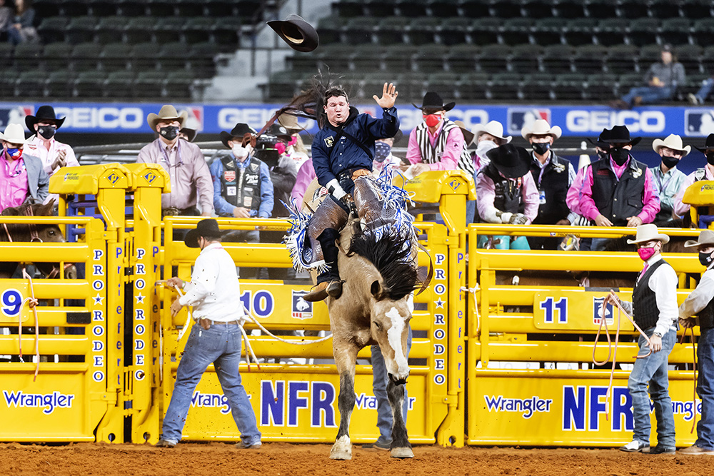Chad Rutherford rides Frontier Rodeo's Gun Fire for 88 points to finish second in Monday's fifth round of the National Finals Rodeo. (PHOTO BY JAMES PHIFER)